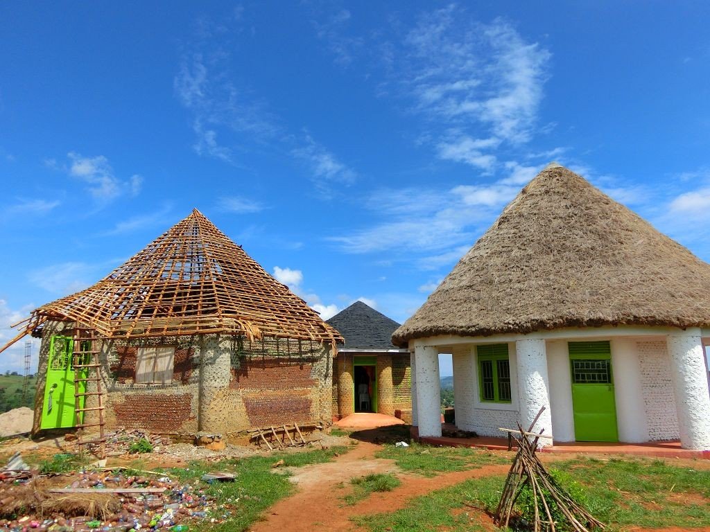 Three of the bottle houses at SINA