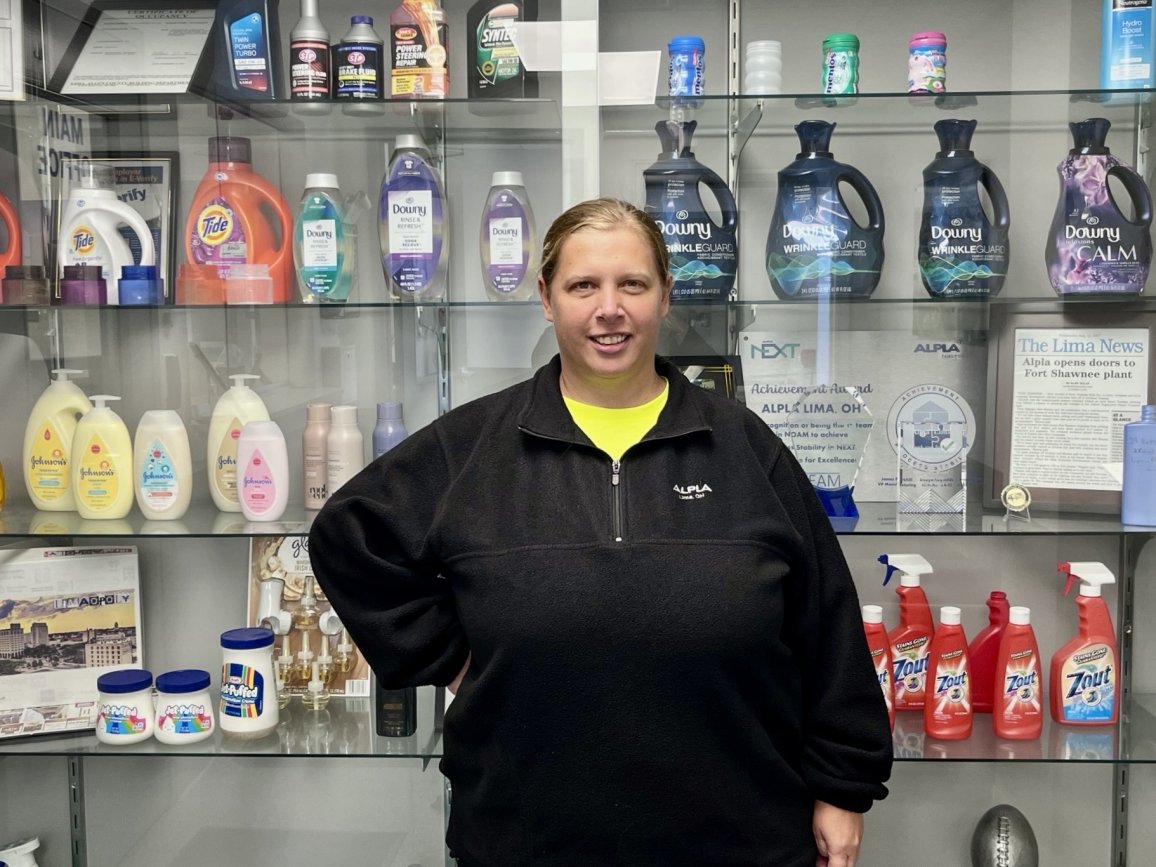 Jenny Logan in front of ALPLA packaging products.