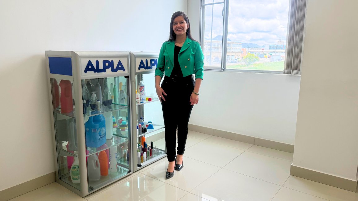 Janeth Bernal in front of ALPLA products