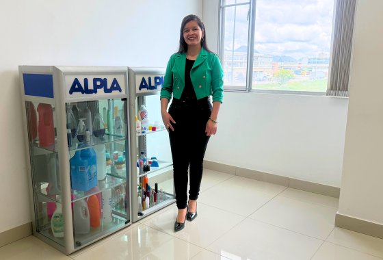 Janeth Bernal in front of ALPLA products