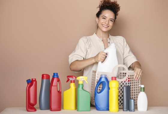 Woman with plastic packaging with recycled contend from ALPLA